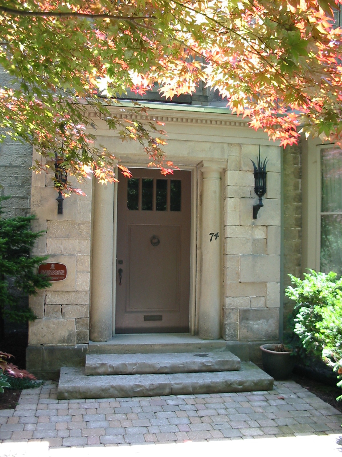 Formal entrance to a stone house in Guelph with natural stone steps